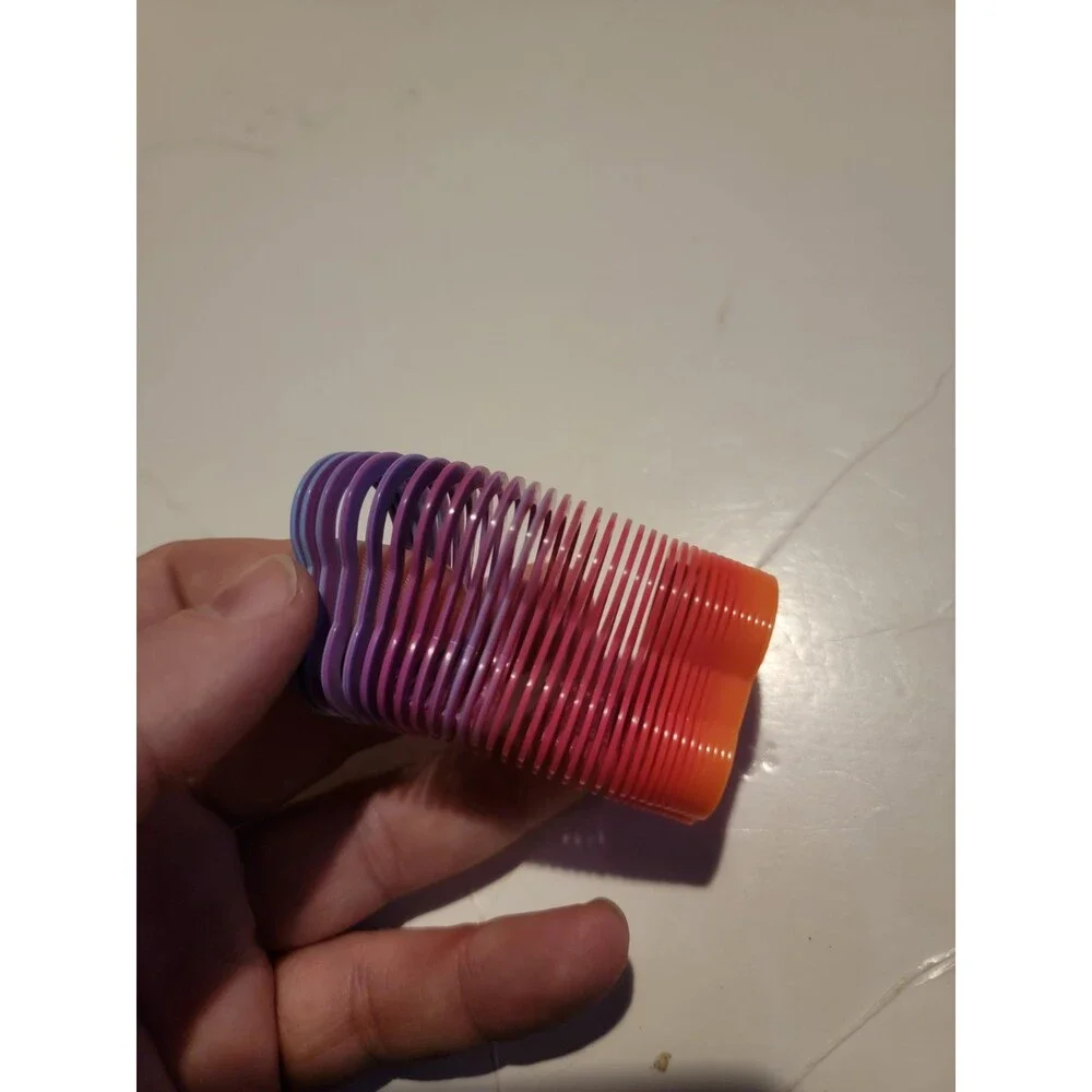 Mini Slinky Style Toy Rainbow Multi Color Spring Coil Foot Shape?